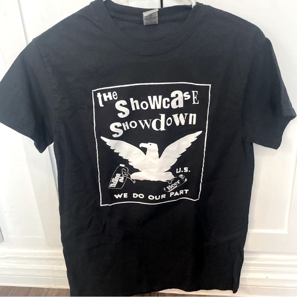 Small black The Showcase Showdown We do our part band tee
